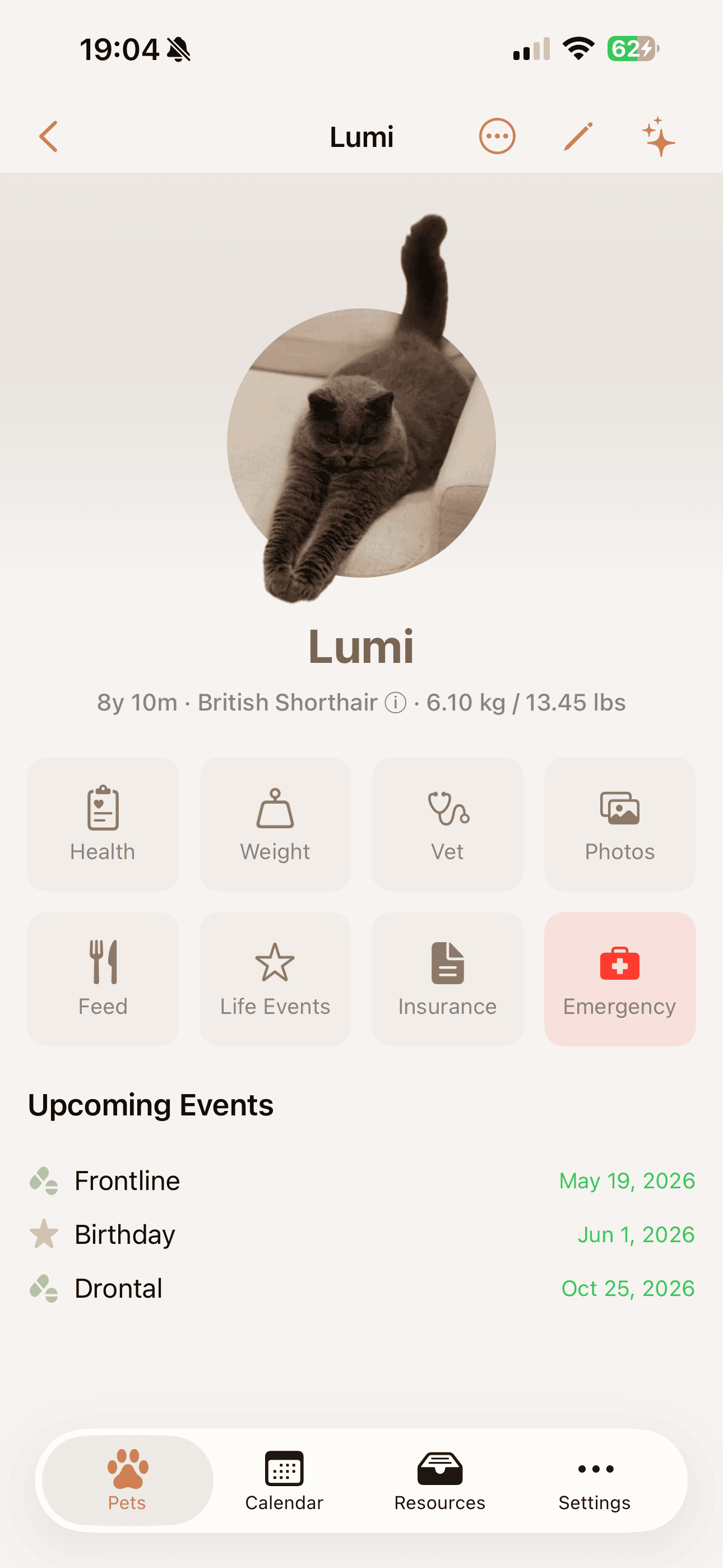 Pet profile hub with health, weight, vet, photos and emergency tiles